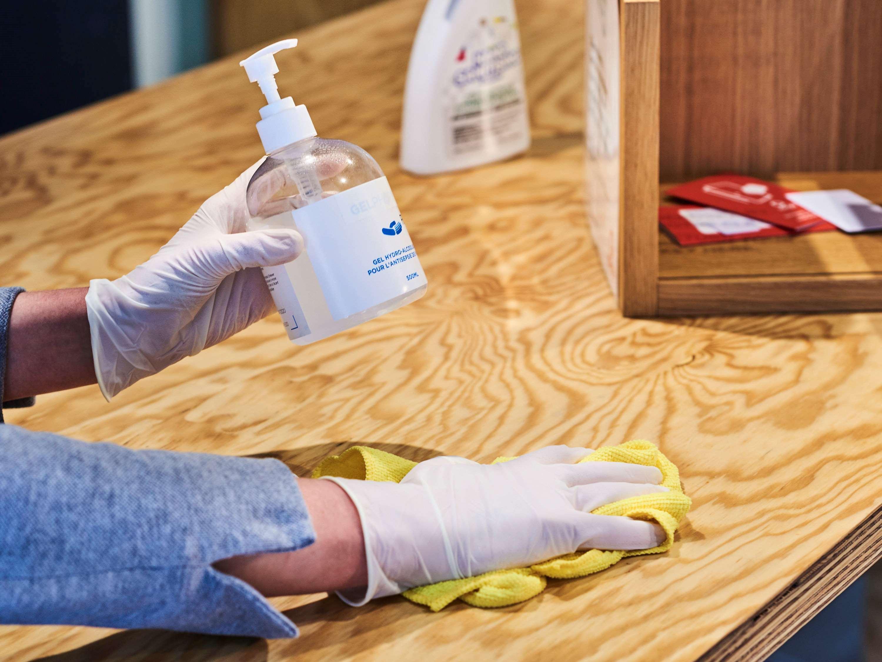 Novotel Chennai Sipcot Exteriör bild Disinfection of a table with a disinfectant