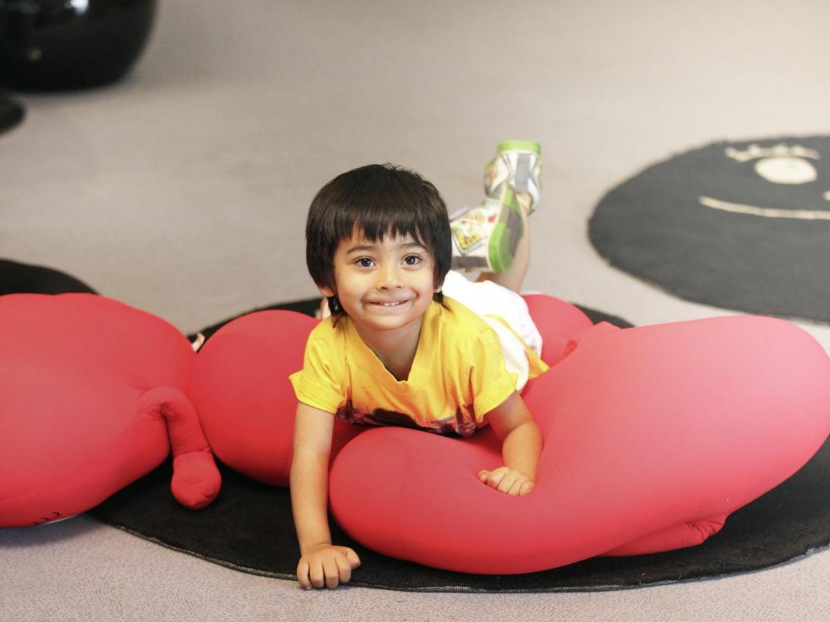 Novotel Chennai Sipcot Exteriör bild A child playing with a bean bag