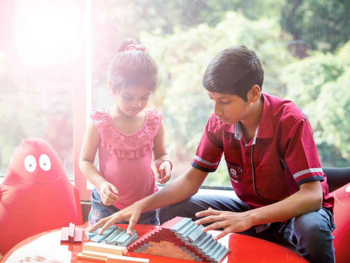Novotel Chennai Sipcot Exteriör bild Children playing with the piano